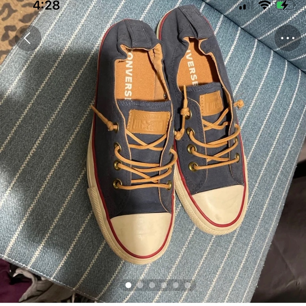 Woman’s slip on navy blue converse.  Size 8